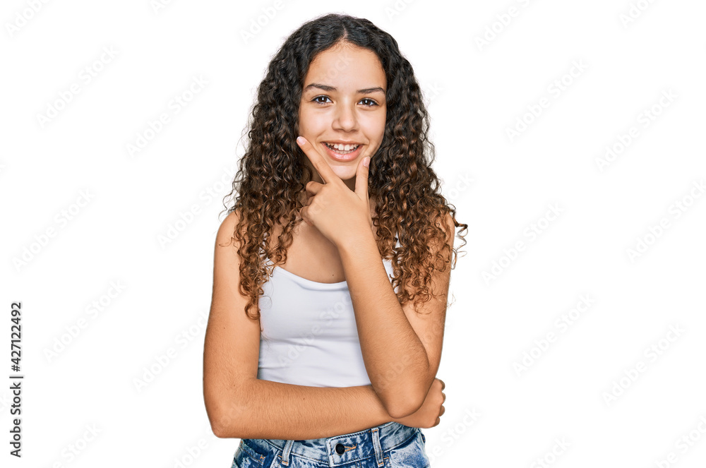 Teenager hispanic girl wearing casual clothes looking confident at the camera smiling with crossed arms and hand raised on chin. thinking positive. Teenager hispanic girl wearing casual clothes looking confident at the camera smiling with crossed arms and hand raised on chin. thinking positive.