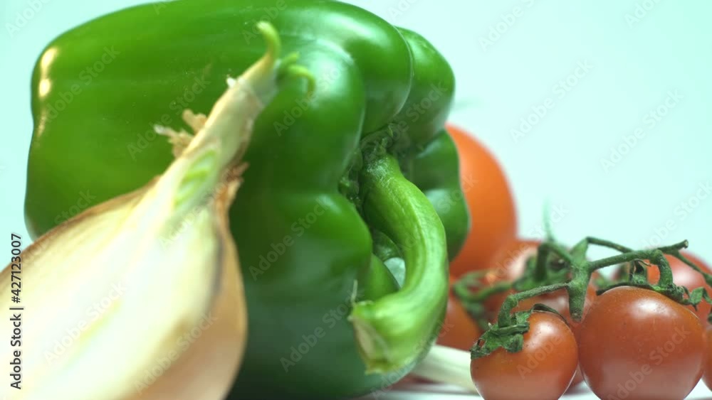 Rotating vegetables close up. Lot of Cherry tomatoes red, green peppers are rotating. Fresh vegetables close up Rotating vegetables close up. Lot of Cherry tomatoes red, green peppers are rotating. Fresh vegetables close up