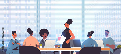 businesswoman leader discussing with mix race businesspeople group during conference meeting