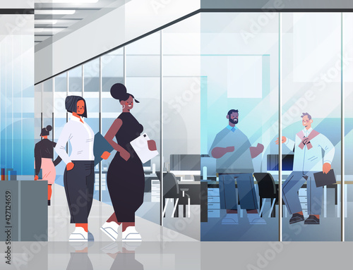 businesspeople discussing during meeting business communication concept colleagues working in office