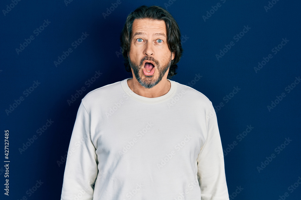 Middle age caucasian man wearing casual clothes afraid and shocked with surprise expression, fear and excited face. Middle age caucasian man wearing casual clothes afraid and shocked with surprise expression, fear and excited face.