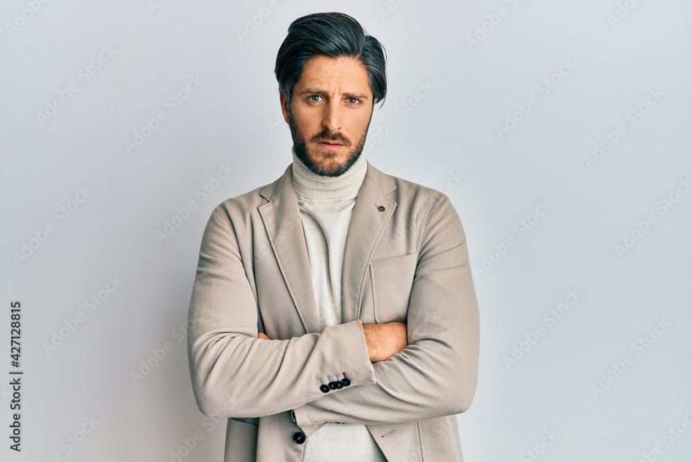 Young hispanic man with arms crossed gesture clueless and confused expression. doubt concept. Young hispanic man with arms crossed gesture clueless and confused expression. doubt concept.