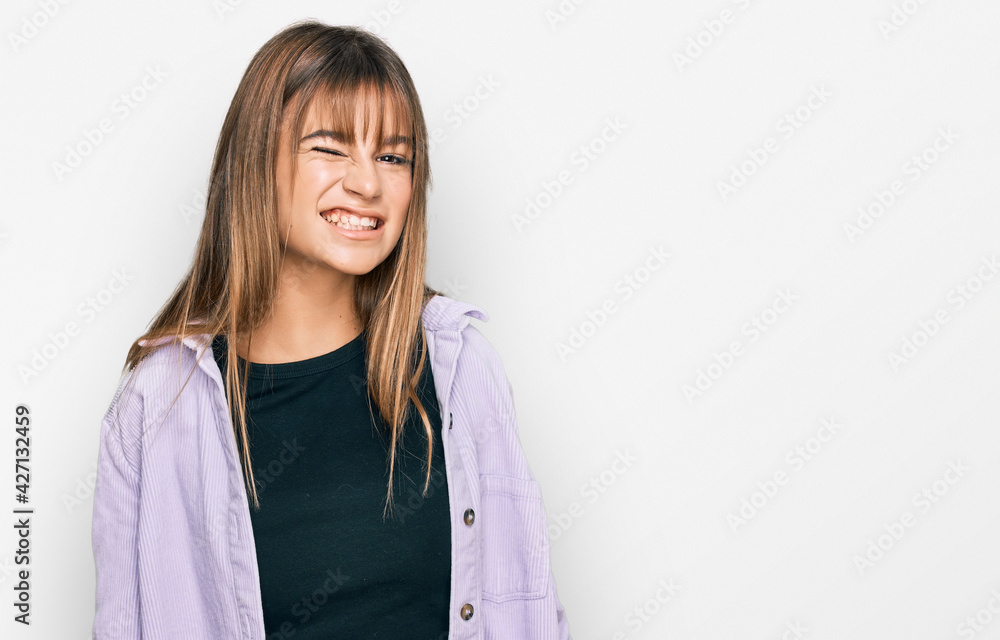 Teenager caucasian girl wearing casual clothes winking looking at the camera with sexy expression, cheerful and happy face. Teenager caucasian girl wearing casual clothes winking looking at the camera with sexy expression, cheerful and happy face.