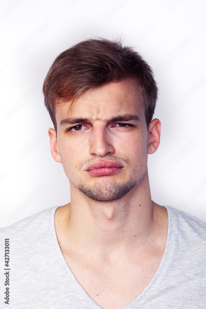 young handsome teenage hipster guy posing emotional, happy smiling against white background isolated, lifestyle people concept young handsome teenage hipster guy posing emotional, happy smiling against white background isolated, lifestyle people concept