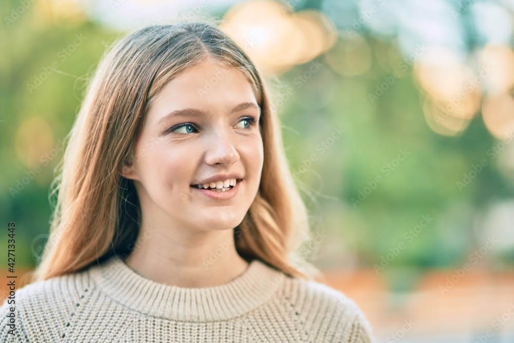 Beautiful caucasian teenager smiling happy standing at the city. Beautiful caucasian teenager smiling happy standing at the city.