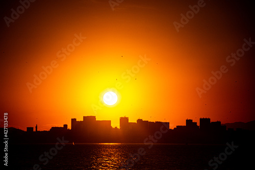 sunset over the city © Emilio