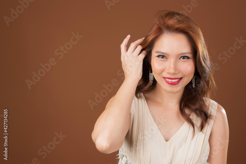 beautiful woman, pretty girl on brown background, asian woman