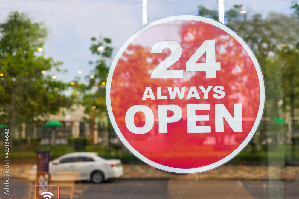 24 Hours Always Open Sign in front of the coffee shop cafe or co-working space in the town. 24 Hours Always Open Sign of department store shop near roadside. Business shop concept 24 Hours Always Open Sign in front of the coffee shop cafe or co-working space in the town. 24 Hours Always Open Sign of department store shop near roadside. Business shop concept