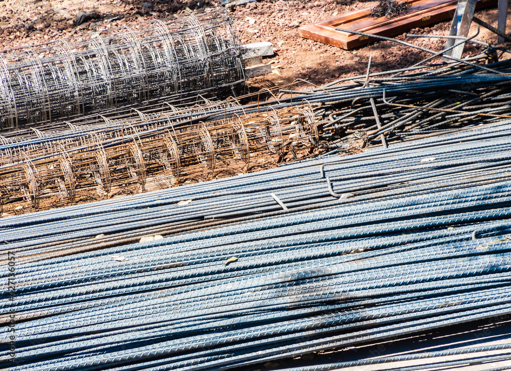 Fototapeta premium metal rods and tubes used in concrete construction, rebar concept