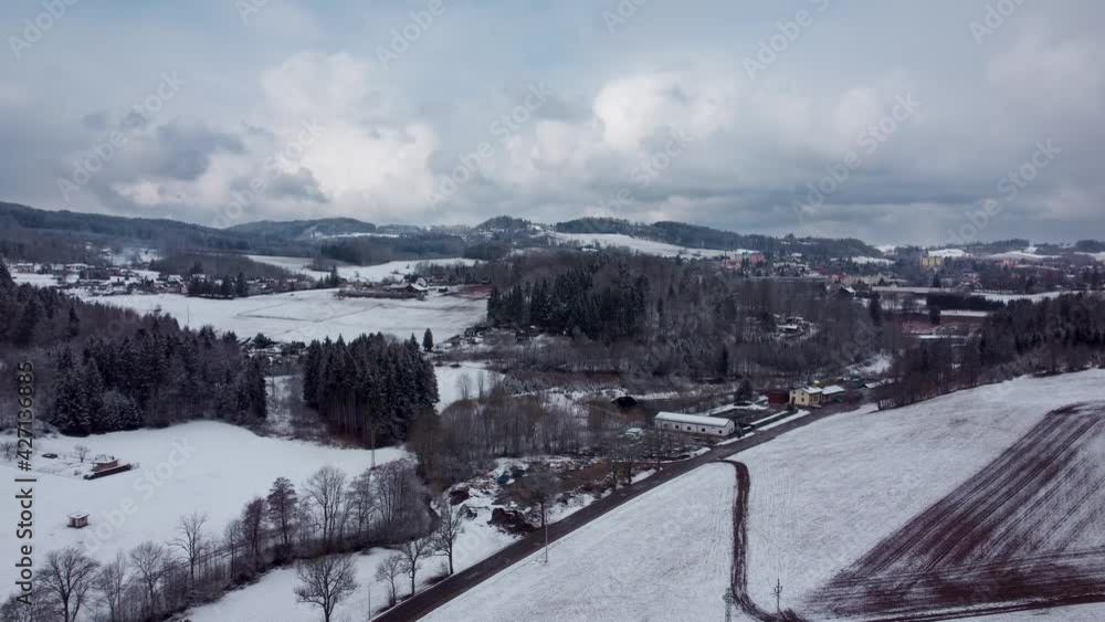snowy rural landscape of Czechia with beautiful clouds, flying forward snowy rural landscape of Czechia with beautiful clouds, flying forward