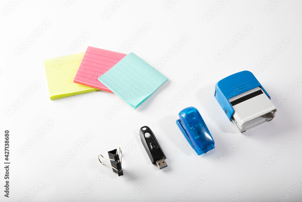Fototapeta premium Neon colored office stationary supplies on white background.