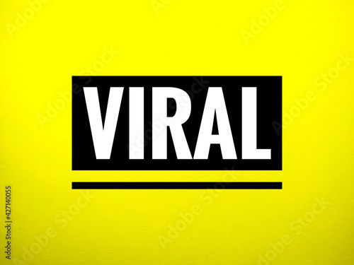 Word VIRAL on yellow background.Typography lettering design,printing for t shrit,banner,poster,mug etc. photo