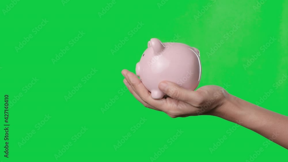 Saving money concept, Asian woman hand putting money coin into piggy ...