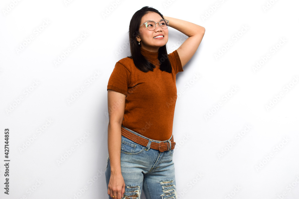 Doing some pose Young beautiful asian women dress orange shirt isolated on white background Doing some pose Young beautiful asian women dress orange shirt isolated on white background