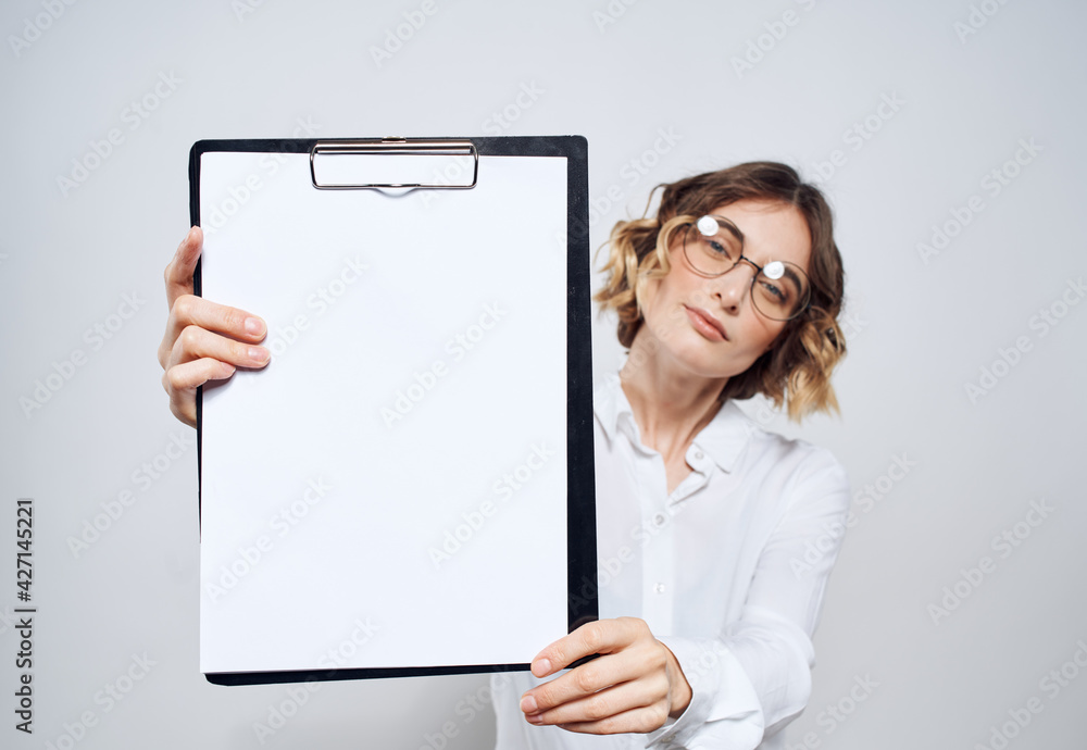 woman with white sheet of paper folder documents gray background mockup woman with white sheet of paper folder documents gray background mockup