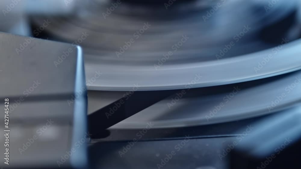 Rewinding crime evidence on magnetic tape in recorder, closeup of play head Rewinding crime evidence on magnetic tape in recorder, closeup of play head