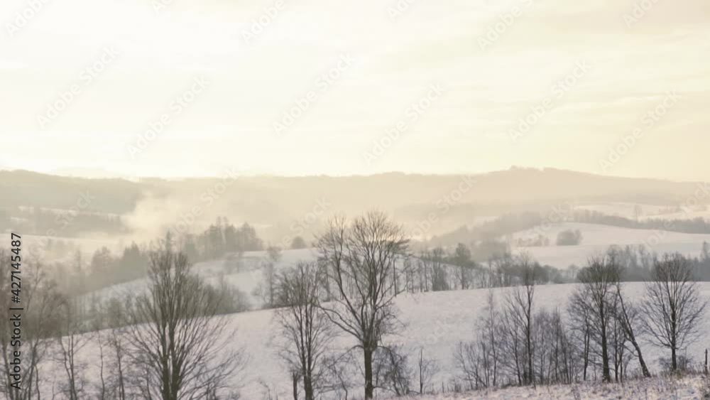 Beautiful winter scenery during epic sunrise at horizon. White wonderland with trees and hills in Czech,Europe. Beautiful winter scenery during epic sunrise at horizon. White wonderland with trees and hills in Czech,Europe.