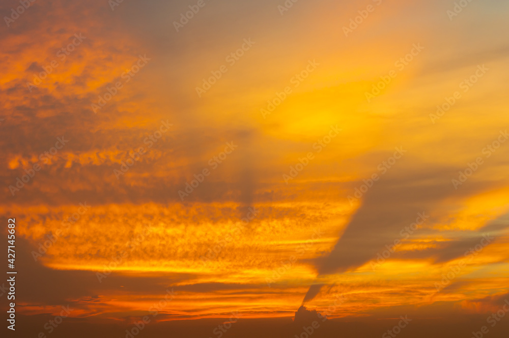 Beautiful Vivid sky painted by the sun leaving bright golden shades.Dense clouds in twilight sky in winter evening.Image of cloud sky on evening time.Evening Vivid sky with clouds. Beautiful Vivid sky painted by the sun leaving bright golden shades.Dense clouds in twilight sky in winter evening.Image of cloud sky on evening time.Evening Vivid sky with clouds.