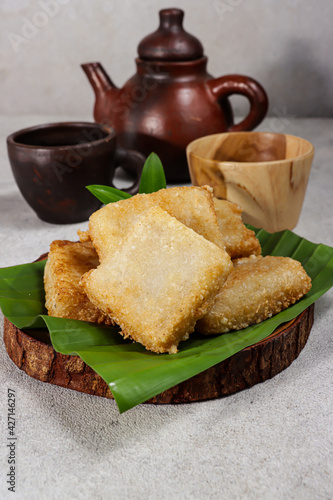 Jadah goreng or Fried sticky rice cake is Javanese traditional cake made from glutinous rice and grated coconut. photo