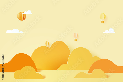 3d Paper cut abstract minimal geometric shape template background.Hot air ballons flying on mountains,clouds and yellow color pastel sky paper art style.