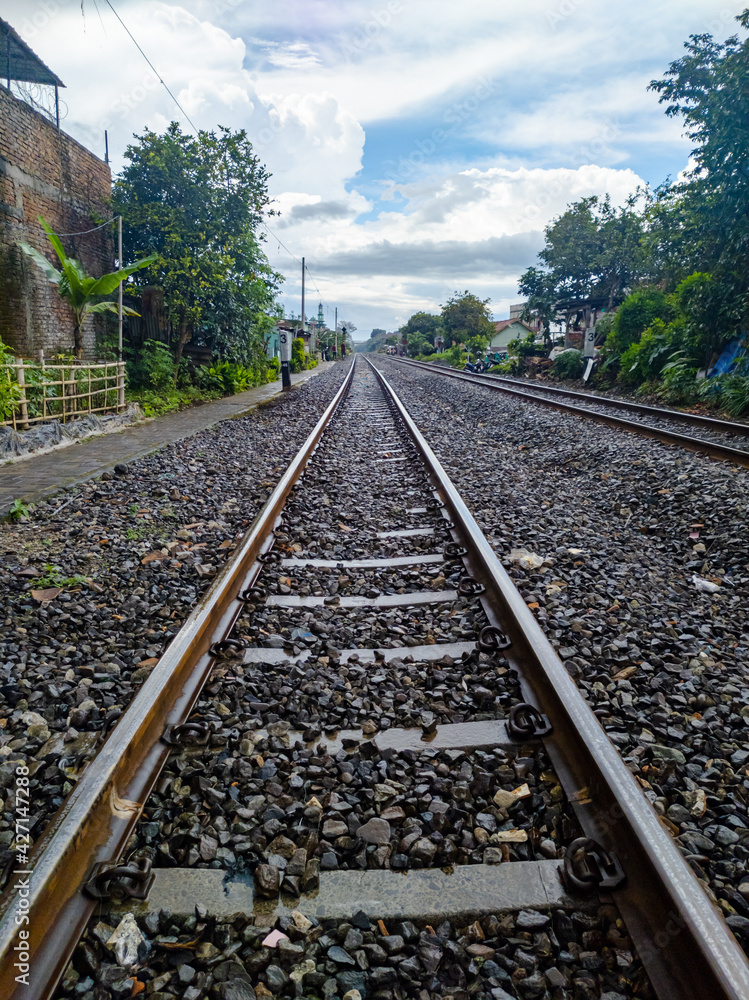 Fototapeta premium Railroad tracks shoot after rain. eye level angle view.