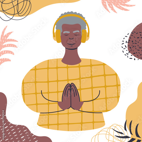 Audio guided meditation. Senior african man relaxing in headphones.