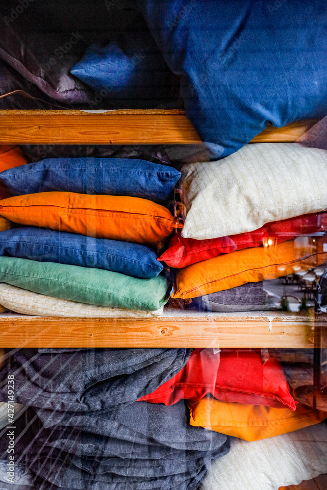 Halmstad, Sweden, A pile of pillows in a shop window. Halmstad, Sweden, A pile of pillows in a shop window.