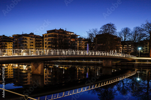 Halmstad  Sweden  A pedestrian bridge over the Nissan river at night.