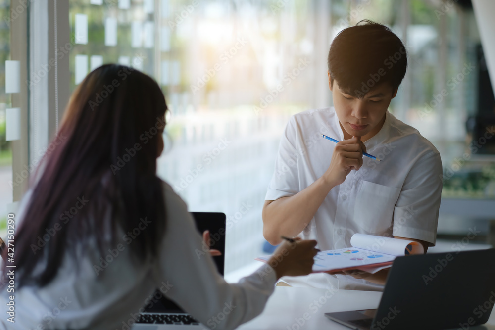 Group of Fund managers researching and analysis Investment stock market by paperwork. Work From Home concept. Group of Fund managers researching and analysis Investment stock market by paperwork. Work From Home concept.