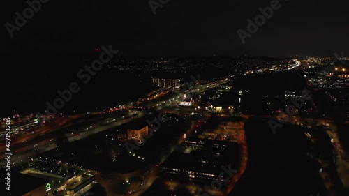 Wallpaper Mural Aerial view of cars driving on a main road in a busy city at night, pull back Torontodigital.ca