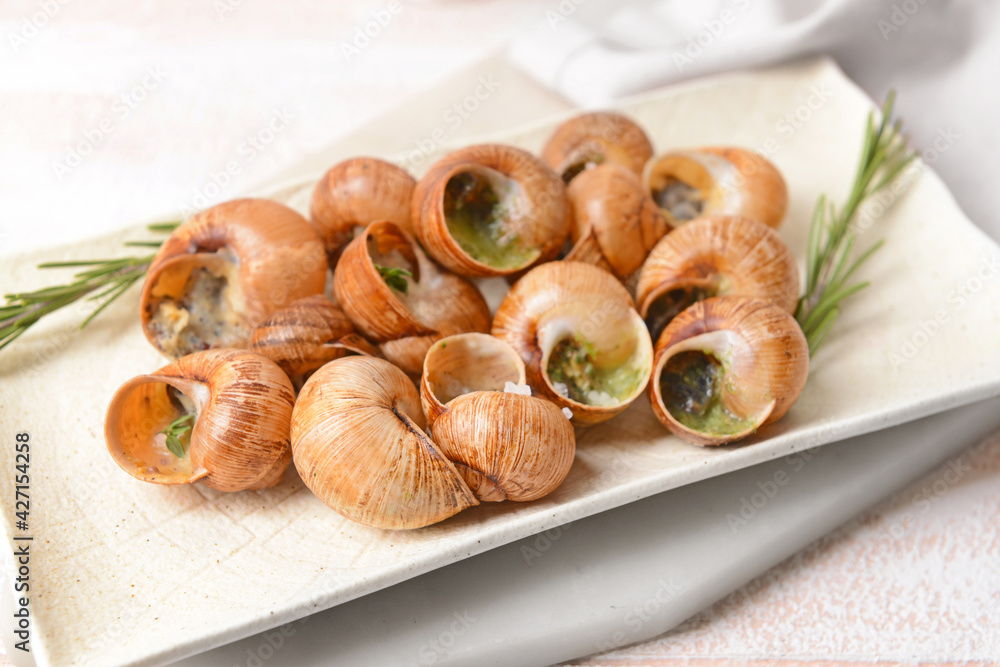 Plate with tasty snails, closeup Plate with tasty snails, closeup