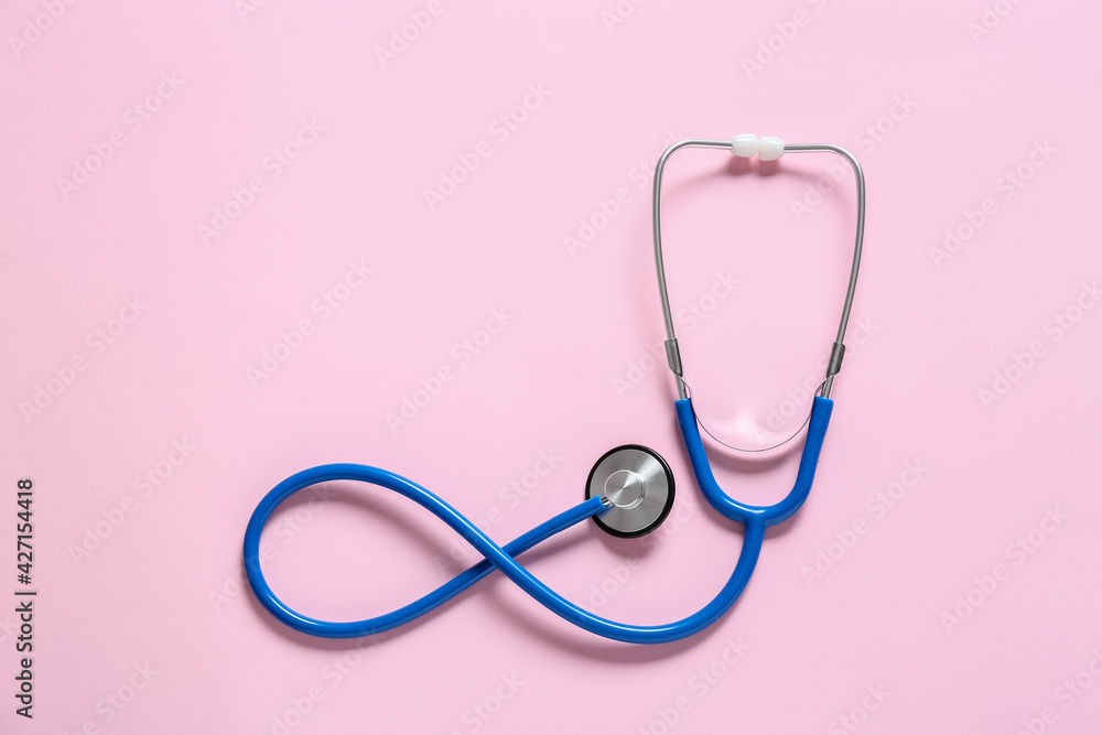Modern stethoscope on color background Modern stethoscope on color background