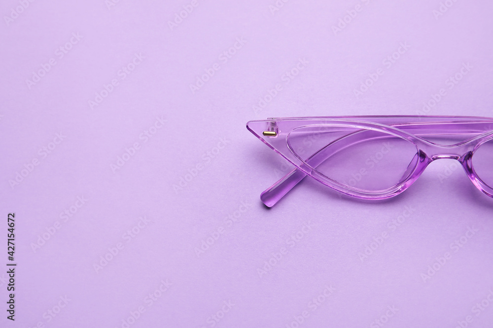Stylish sunglasses on color background Stylish sunglasses on color background