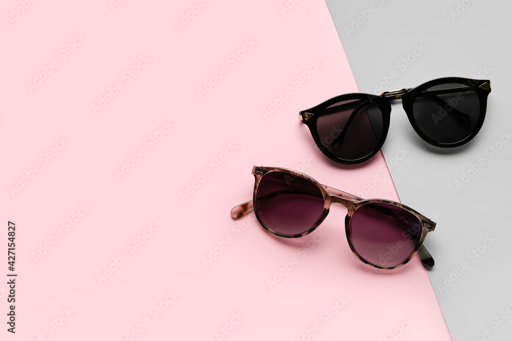 Stylish sunglasses on color background Stylish sunglasses on color background