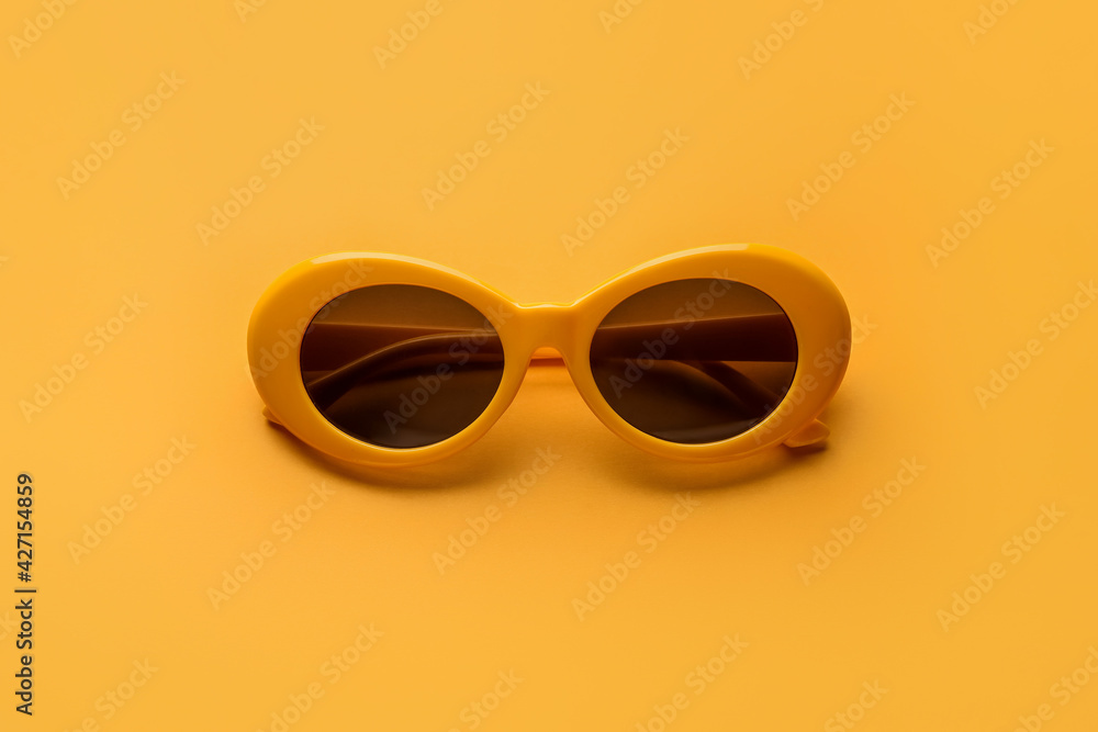 Stylish sunglasses on color background Stylish sunglasses on color background