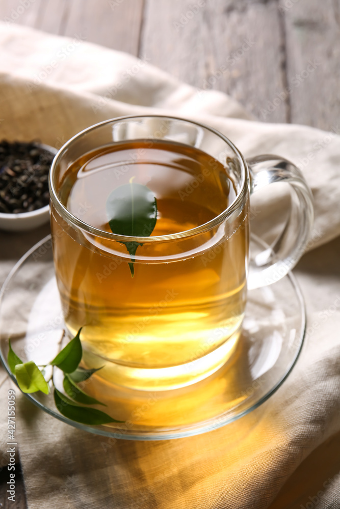 Cup of green tea on wooden background Cup of green tea on wooden background