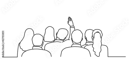 Man raises his hand to ask a question. Back view. 
