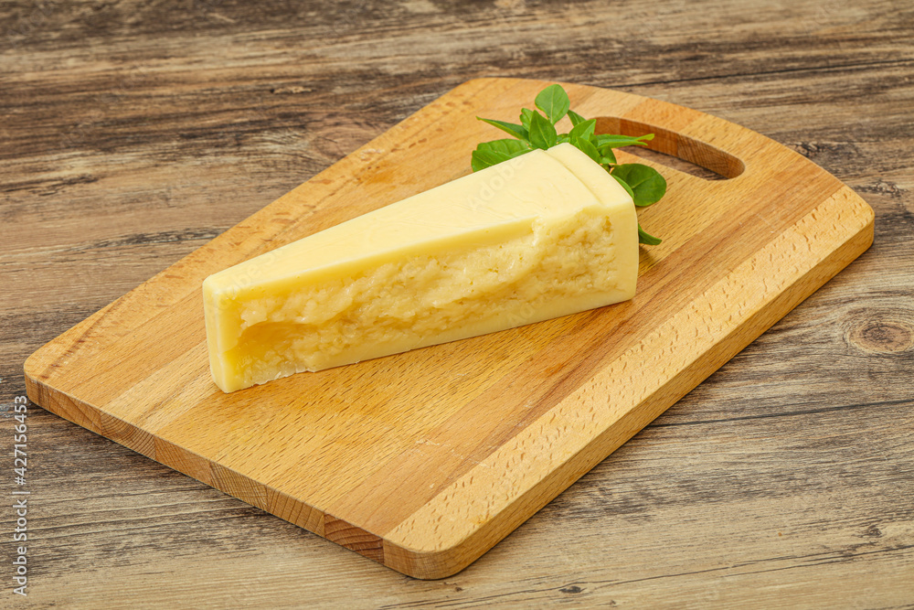 Hard parmesan cheese served basil