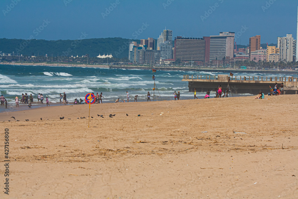 Bathers Enjoying the Sunshine at Durban Beachfront Bathers Enjoying the Sunshine at Durban Beachfront