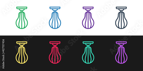Set line Punching bag icon isolated on black and white background. Vector