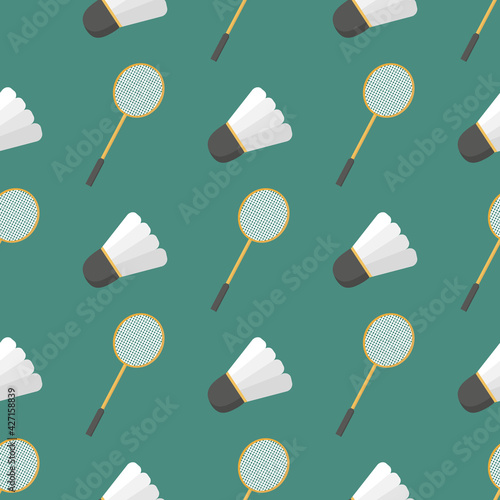 A pattern of a shuttlecock and a badminton racket on a green background