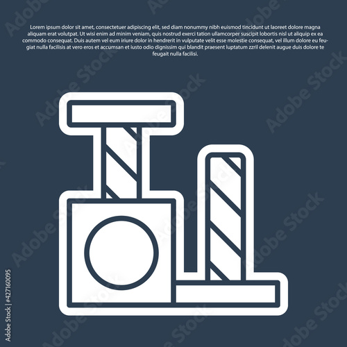 Blue line Cat scratching post with toy icon isolated on blue background. Vector