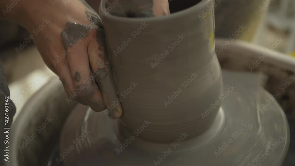 The manufacture of ceramics. Woman working with clay on pottery wheel. The manufacture of ceramics. Woman working with clay on pottery wheel.