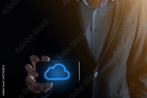 Businessman hand holding cloud computing concept in palm. Backup Storage Data Internet, networking and digital, Share global, and technology, concept.
