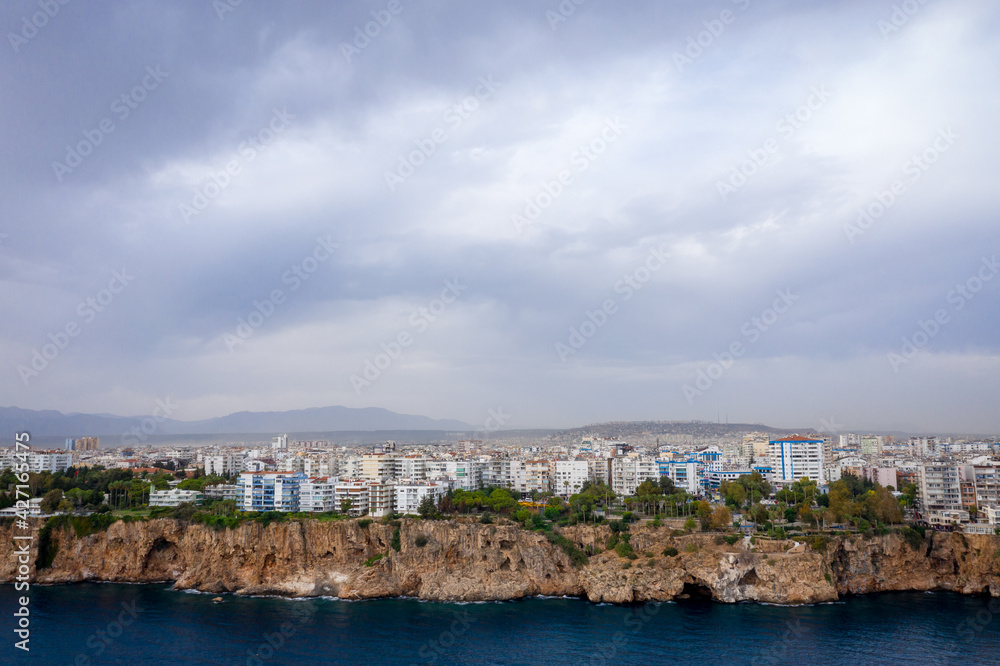 Panoramic photo of Antalya, Turkey. View from the sea to the Mediterranean coast and cityscape