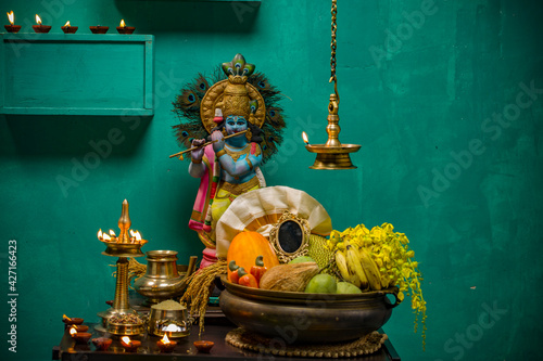 Kerala festival,rituals of Vishu festival -Vishukkani or Vishu sight, a brass vessel  filled with fruits,vegetable, mirror,golden shower flower and new cloth arranged  traditionally