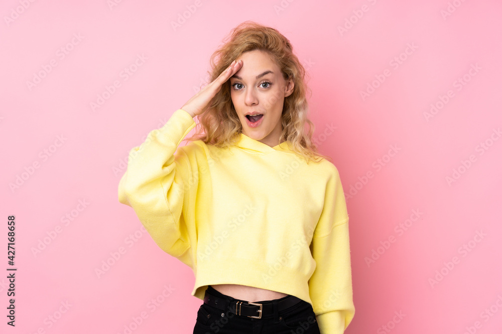 Young blonde woman wearing a sweatshirt isolated on pink background has just realized something and has intending the solution Young blonde woman wearing a sweatshirt isolated on pink background has just realized something and has intending the solution