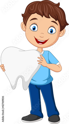 Cartoon little boy holding big tooth