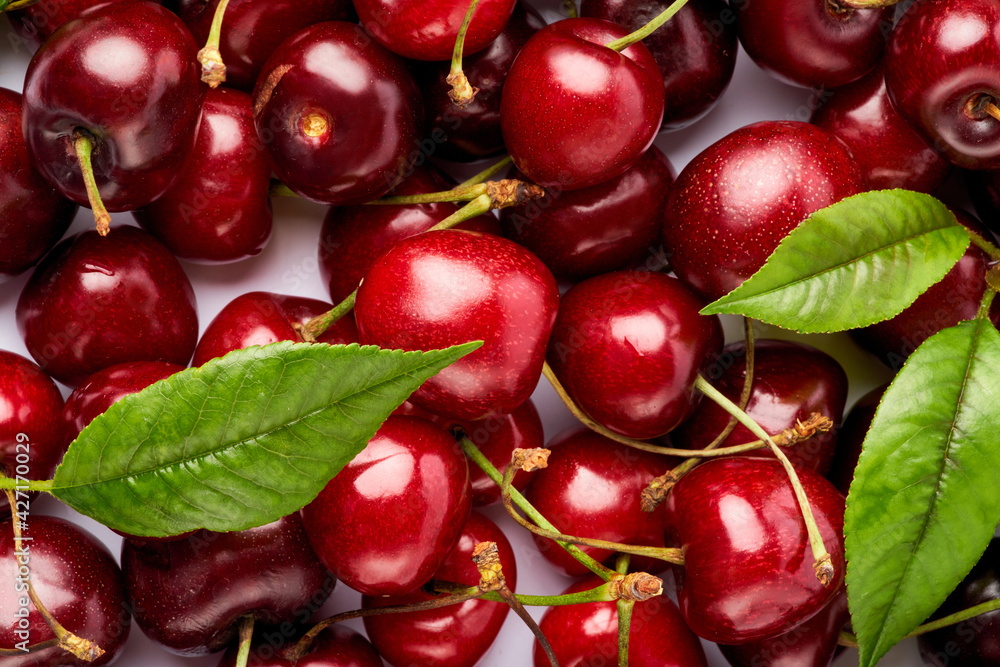 background made of sweet cherry fruits isolated on white background background made of sweet cherry fruits isolated on white background