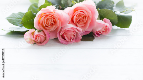 Pink roses on white   wooden board, space for text. Template for Wedding , 8 march, womens day, Mother's Day, Birthday Card. Pink flowers board, pink flowers layout, pink roses background